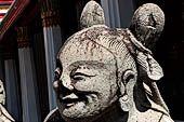 Bangkok Wat Arun - the gallery is lined all around with beautiful statues of chinese figures. 